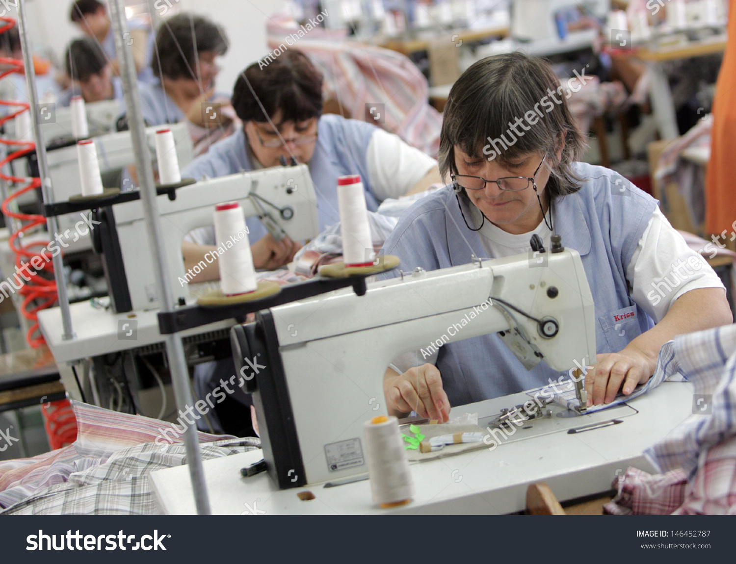 stock-photo-pazardjik-bulgaria-december-women-ironed-shirts-in-clothing-factory-dec-pazardjik-146452787