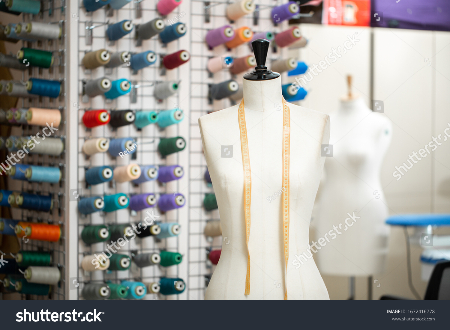 stock-photo-sartorial-mannequin-in-a-sewing-atelier-1672416778