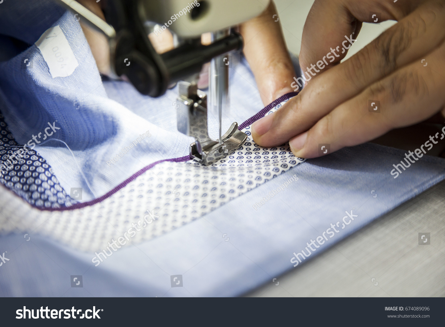 stock-photo-textile-factory-tailor-working-on-sewing-machine-674089096
